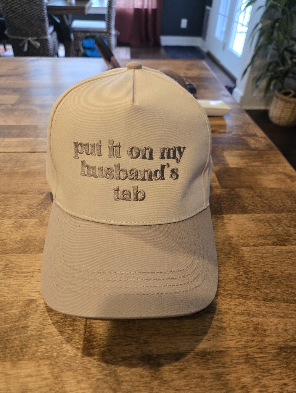 Put It On My Husband's Tab Embroidered Trucker Hat Cream & Beige
